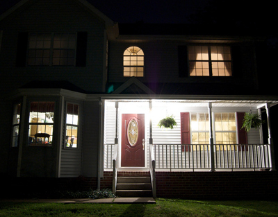 Home with curtains open at night