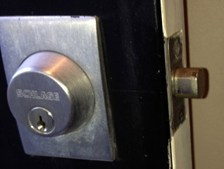 Deadbolt style lock on a door - Close up