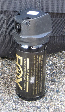 A can of Fox Labs brand of pepper spray on the ground