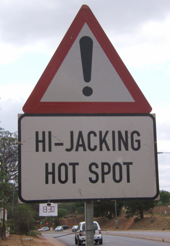 Hijacking - sign indicating a high risk of hijacking on this road