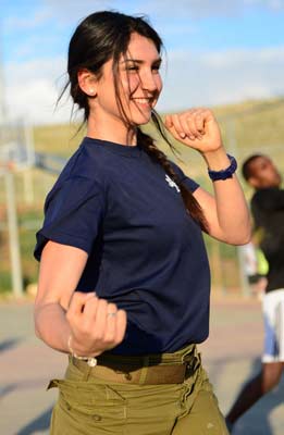 Krav maga girl punching during training