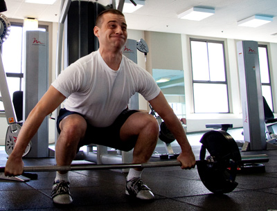 Muscular strength training - Man lifting barbell