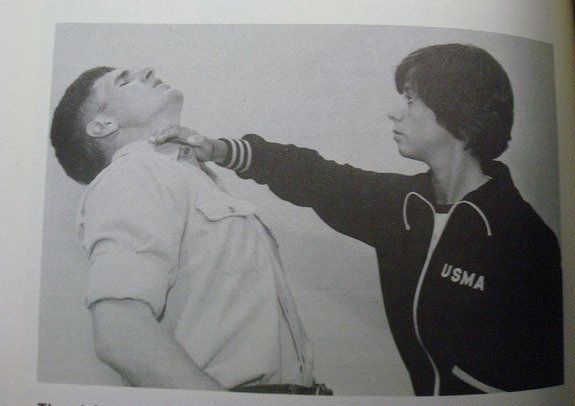 Old picture from a book of someone demonstrating the knife hand strike to the throat