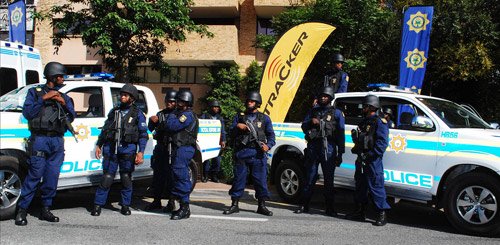 South African police standing near their cars