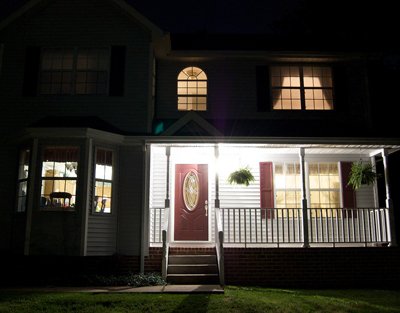 Home with curtains open at night