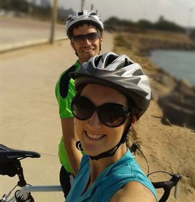 Evan and his wife cycling on a sunny day in South Africa