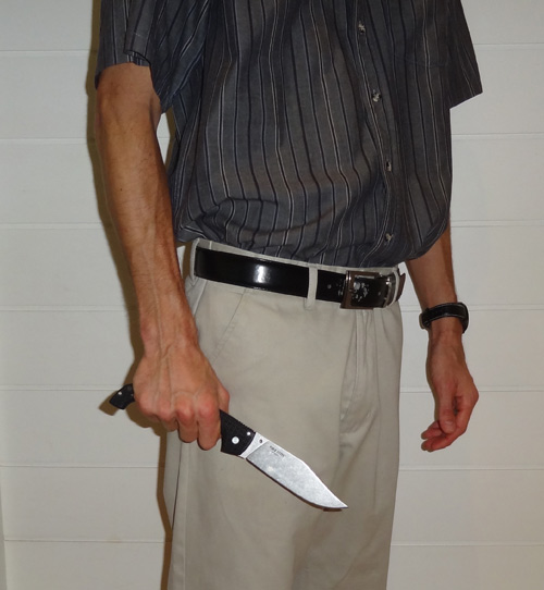 Man holding a Cold Steel Voyager X2 in hand