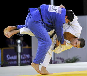 Martial art training - Judo player throwing another in competition