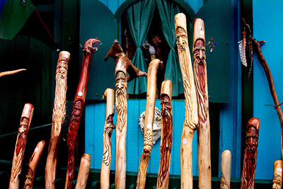 Several ornately carved walking sticks or canes