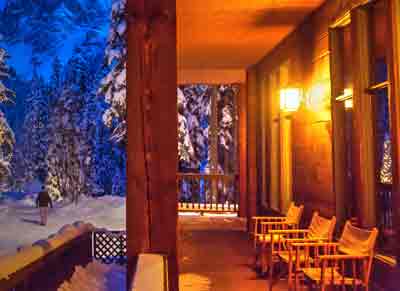 Lighting outside a beautiful cabin in the snow