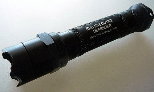 A Surefire E2D tactical flashlight