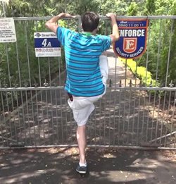 Fence test 1 - Evan climbing over someone's steel spiky gate